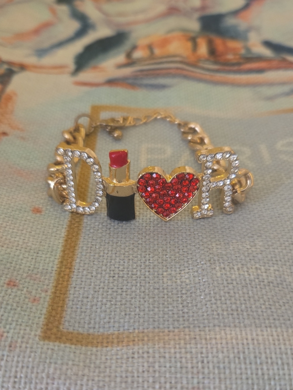 Gold Tone 'D♥R' Charm Chain Bracelet with Red Lipstick & Red Crystal Heart